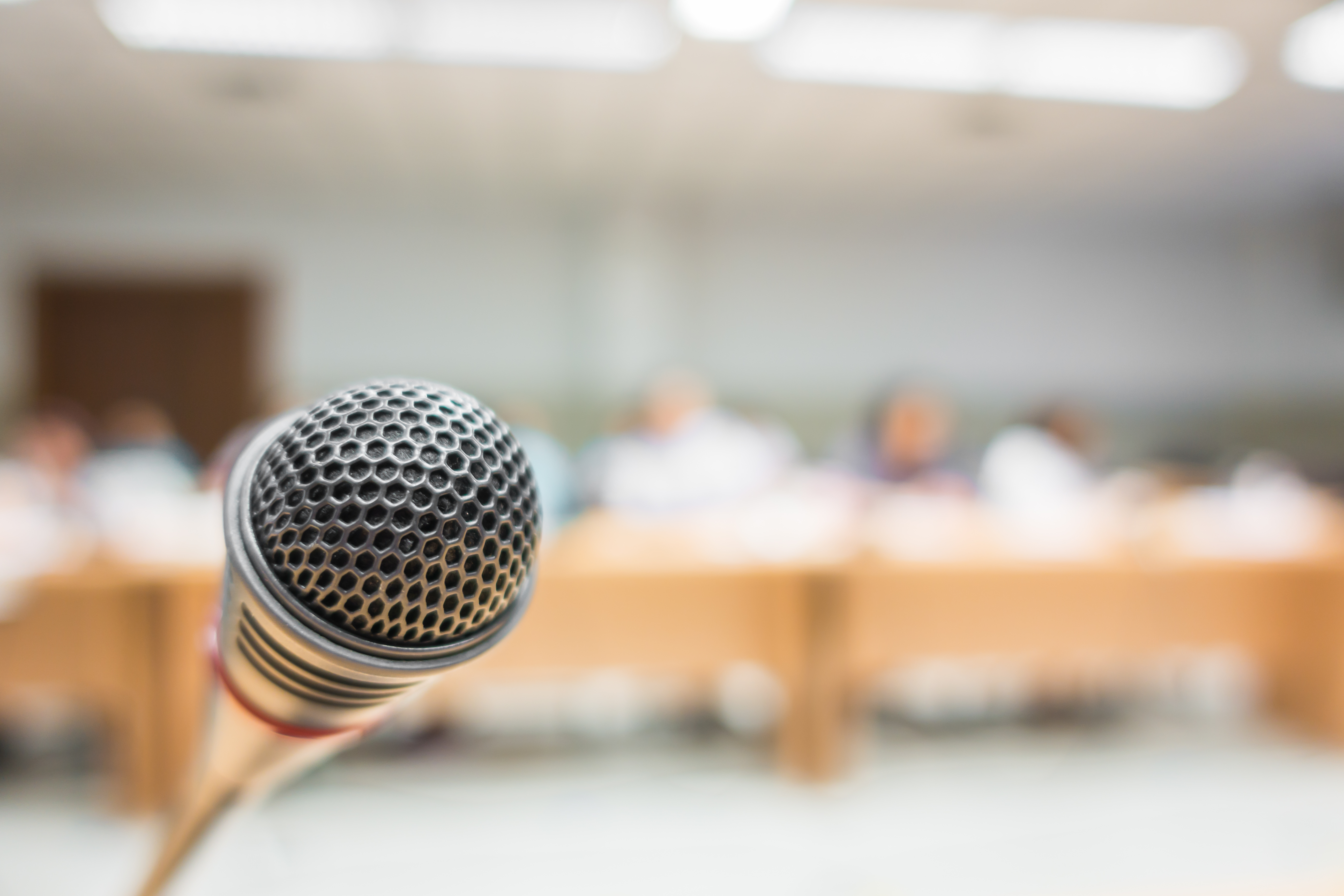 Black microphone in conference room ( Filtered image processed vintage effect. )