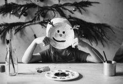 Little girl wearing a reindeer mask 