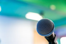 Black microphone in conference room ( Filtered image processed vintage effect. )