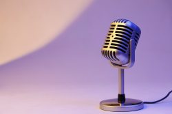 retro microphone isolated on color background