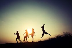 Children playing on summer sunset happy time